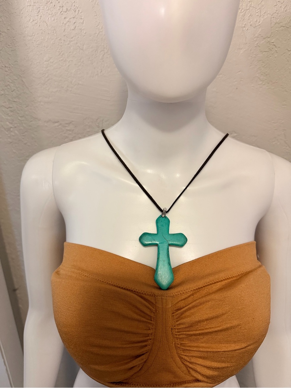 Turquoise Cross Pendant Necklace on Dark Brown Cord.